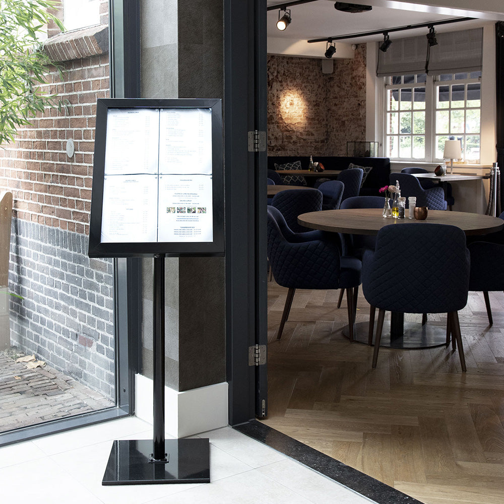 A set of four A4 black tamperproof LED restaurant menu display boards, designed for floor-standing or wall-mounted use, providing a secure and illuminated way to showcase menus.
