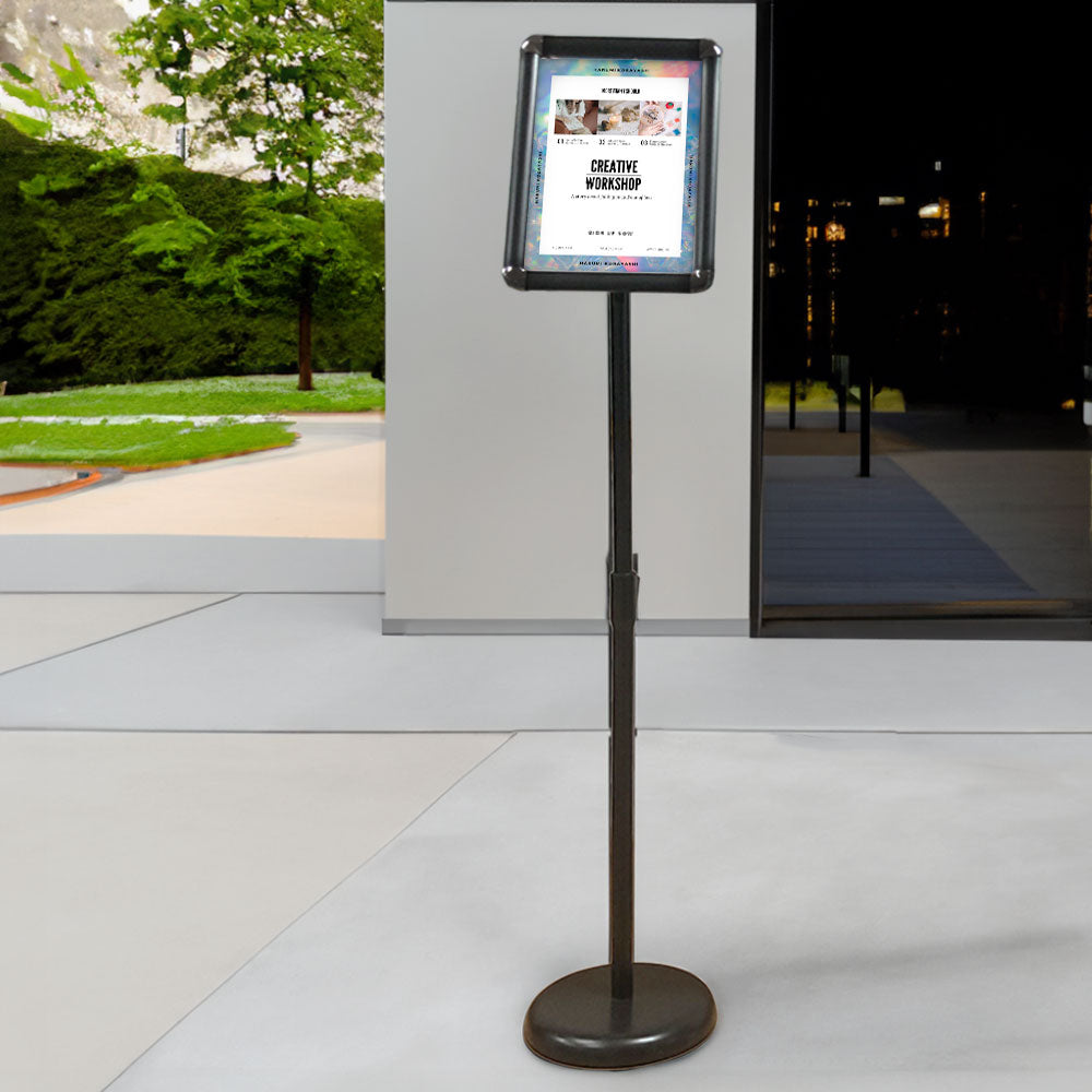 A4 black floor-standing sign holder with adjustable height and angle for versatile display.
