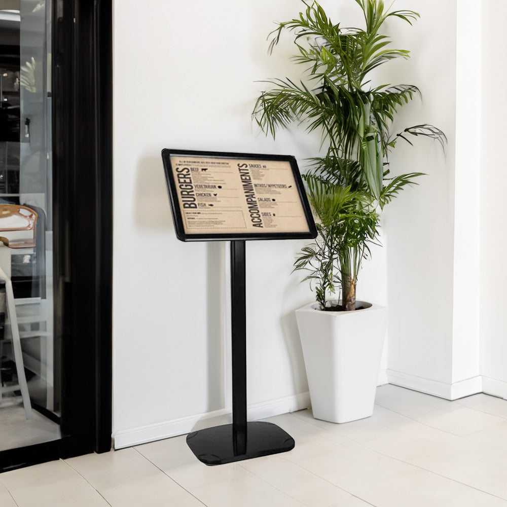 Black A3 floor-standing snap frame poster display stand with a 25mm mitred frame and adjustable orientation, measuring 1075mm high by 326mm wide.