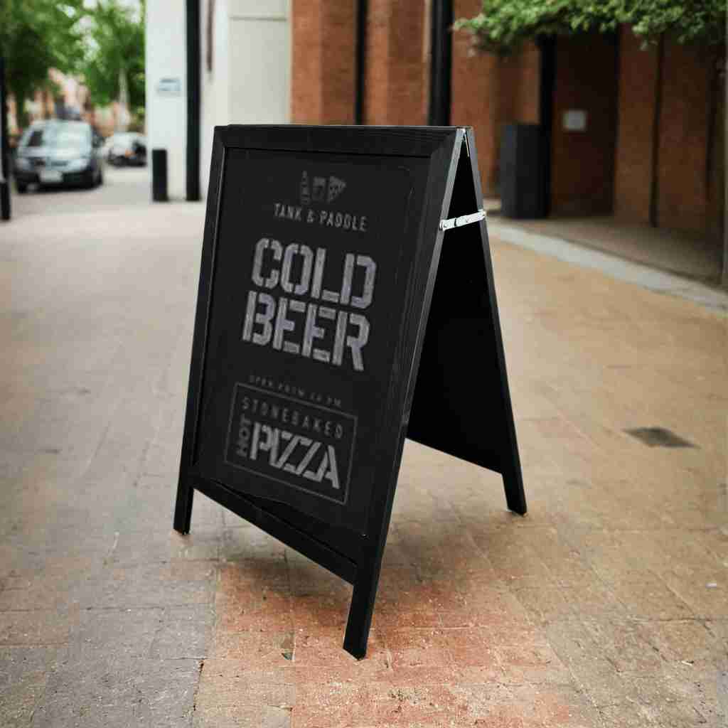 A stylish black wooden outdoor chalk A-board pavement sign, perfect for cafés, restaurants, and retail promotions.
