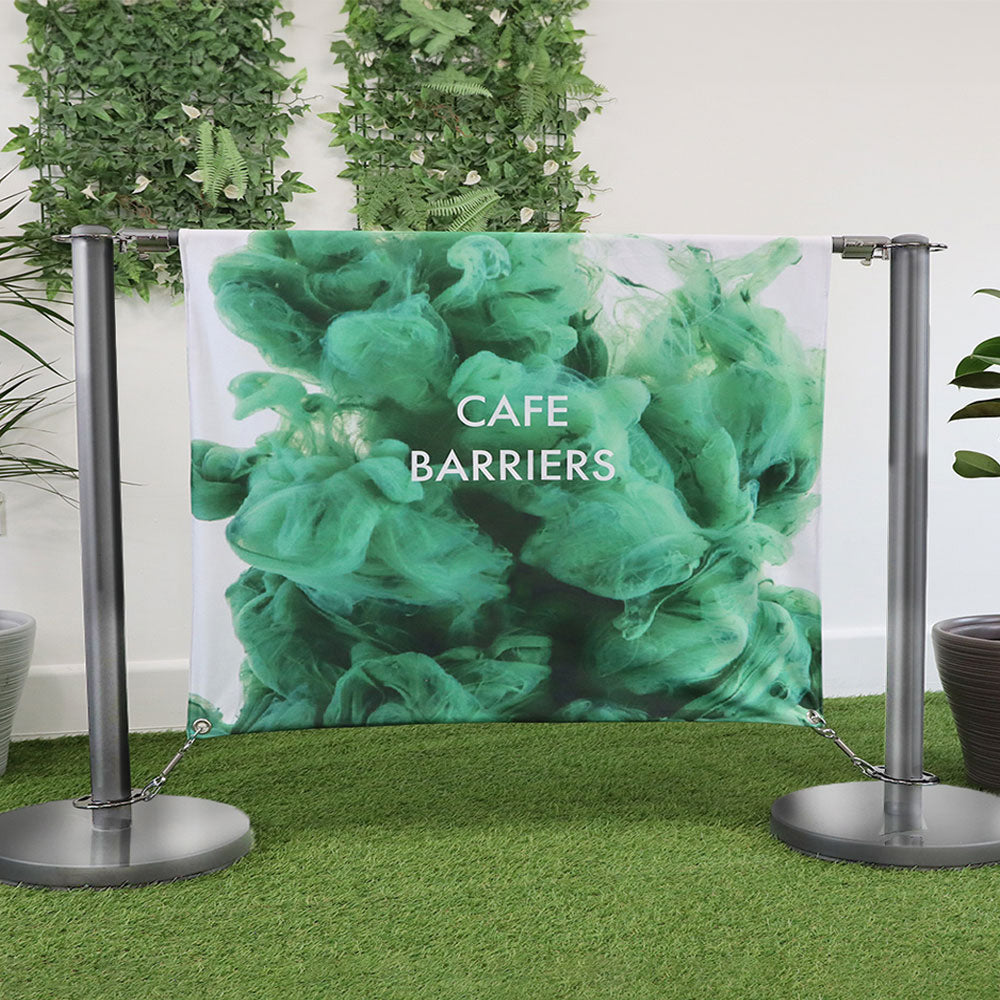 "Chrome steel café barrier with a 1.5m double-sided graphic print, perfect for outdoor seating areas and queue management.
"
