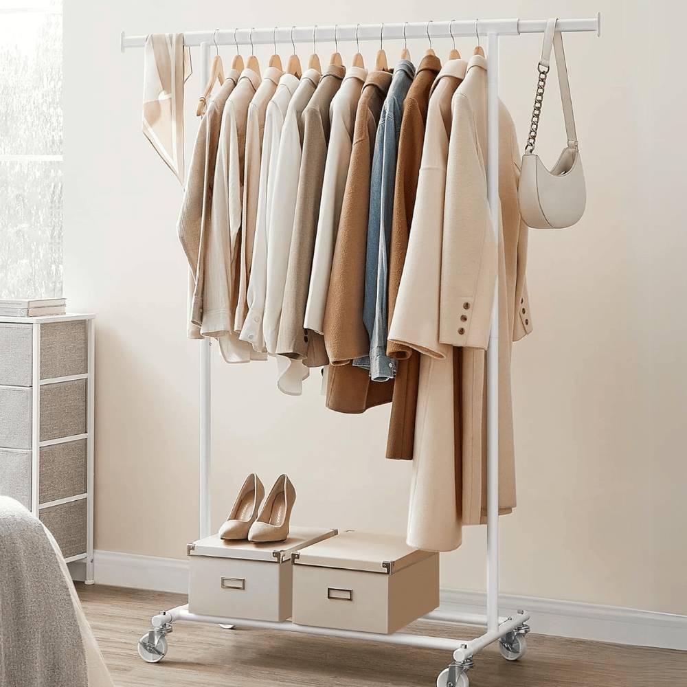 Extendable white steel clothes rail with built-in storage and a shoe shelf, perfect for organised wardrobes.
