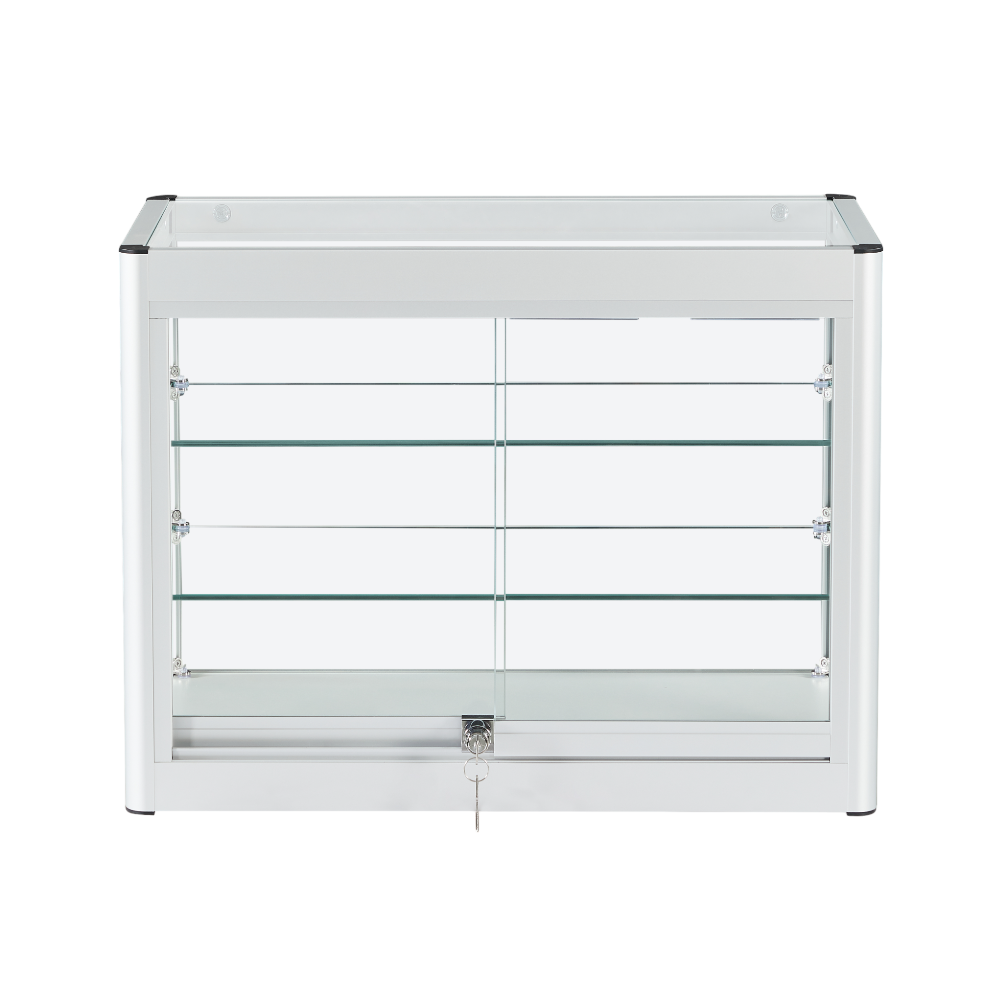 Secure and stylish lockable glass display cabinet with a silver aluminium frame, two shelves, and a space-saving sliding door for easy access.
