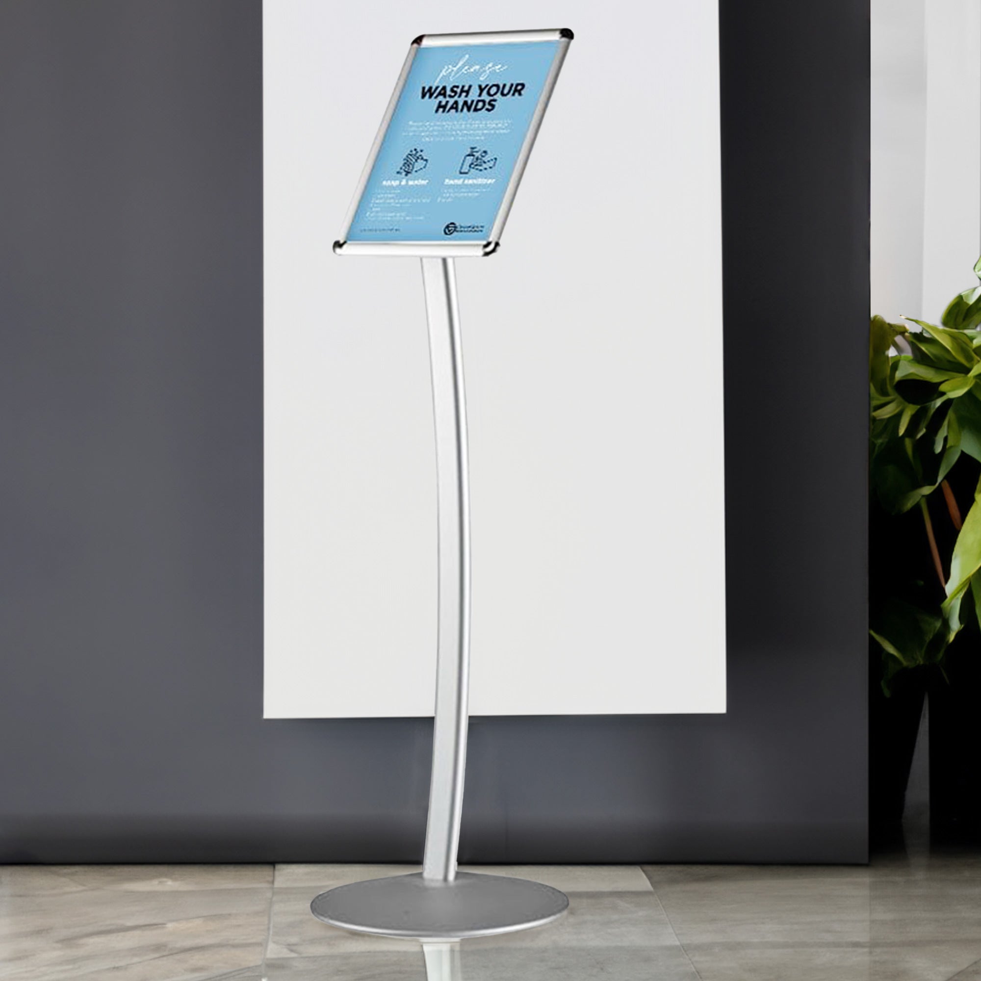 Silver A4 floor-standing poster display stand with a curved aluminium snap frame, measuring 240mm wide by 1212mm high.
