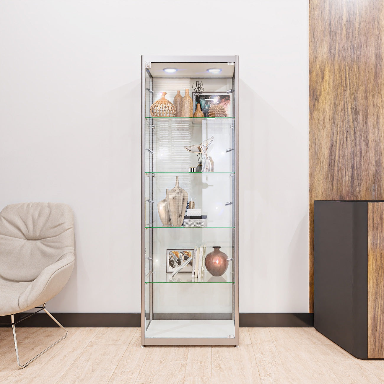 Sleek silver aluminium glass display cabinet with lockable doors, four adjustable shelves, and ten LED lights, measuring 1800mm high by 600mm wide.